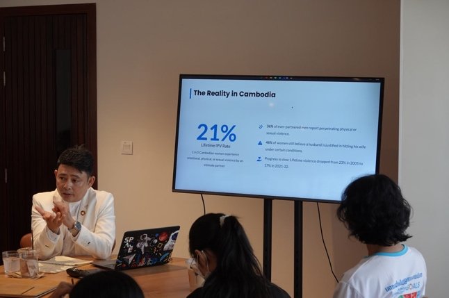 A guest speaker presents data on gender-based violence in Cambodia during the Peace Café session